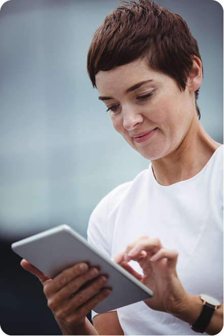 Person reading Megamax blog articles on a tablet